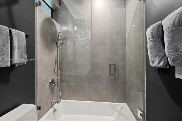 a bathroom with a shower and toilet