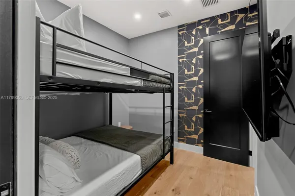 a bedroom with a bed and a walk in closet