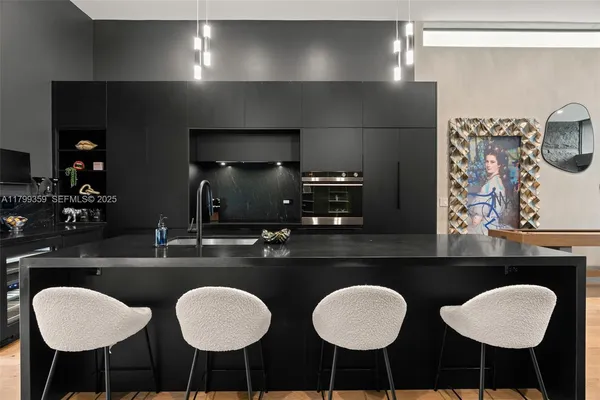 a dining room with chairs and a table