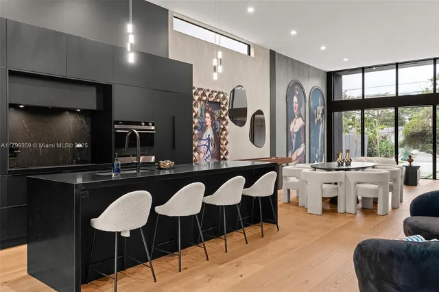 a large kitchen with a table and chairs