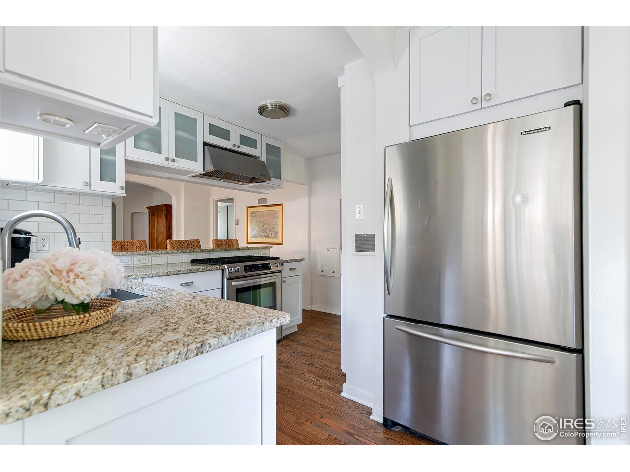 764 14th Street Boulder, CO 80302 - Photo 11 of 40 a kitchen with stainless steel appliances granite countertop a refrigerator a stove and a sink