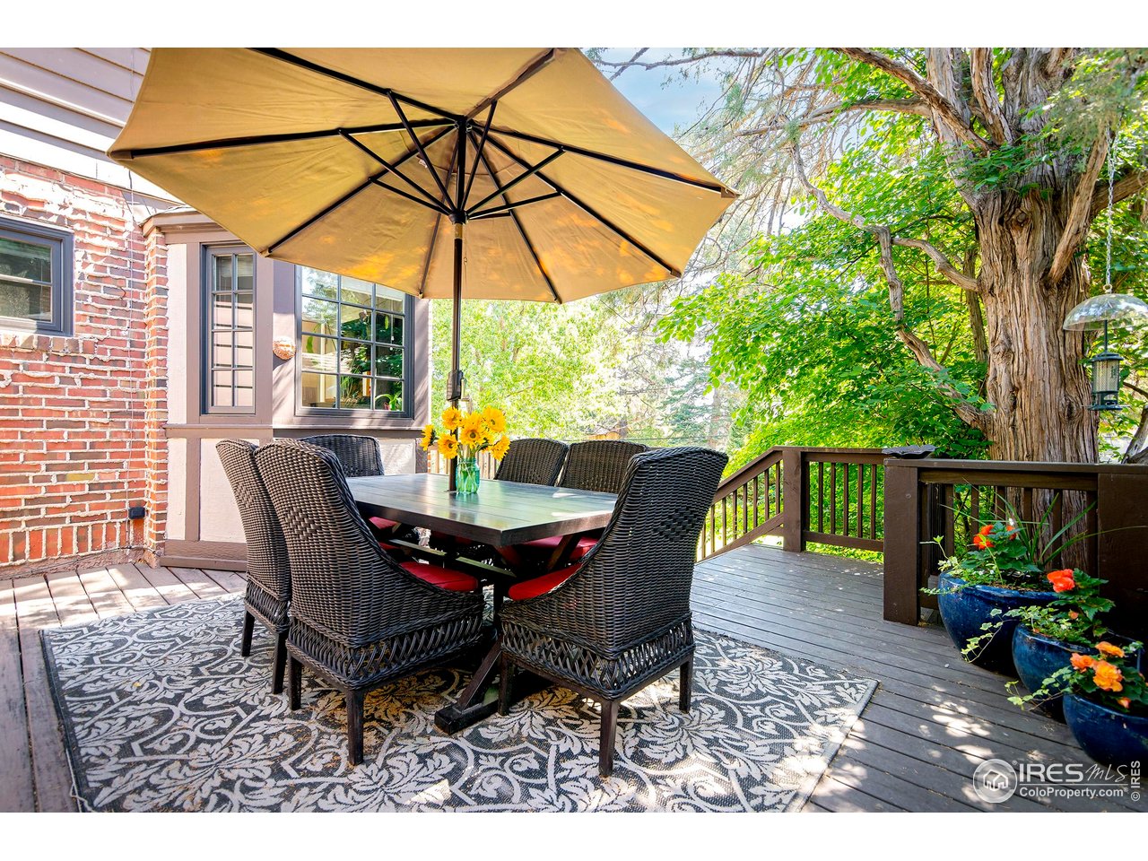 764 14th Street Boulder, CO 80302 - Photo 13 of 40 a view of a dining table and chairs in the patio