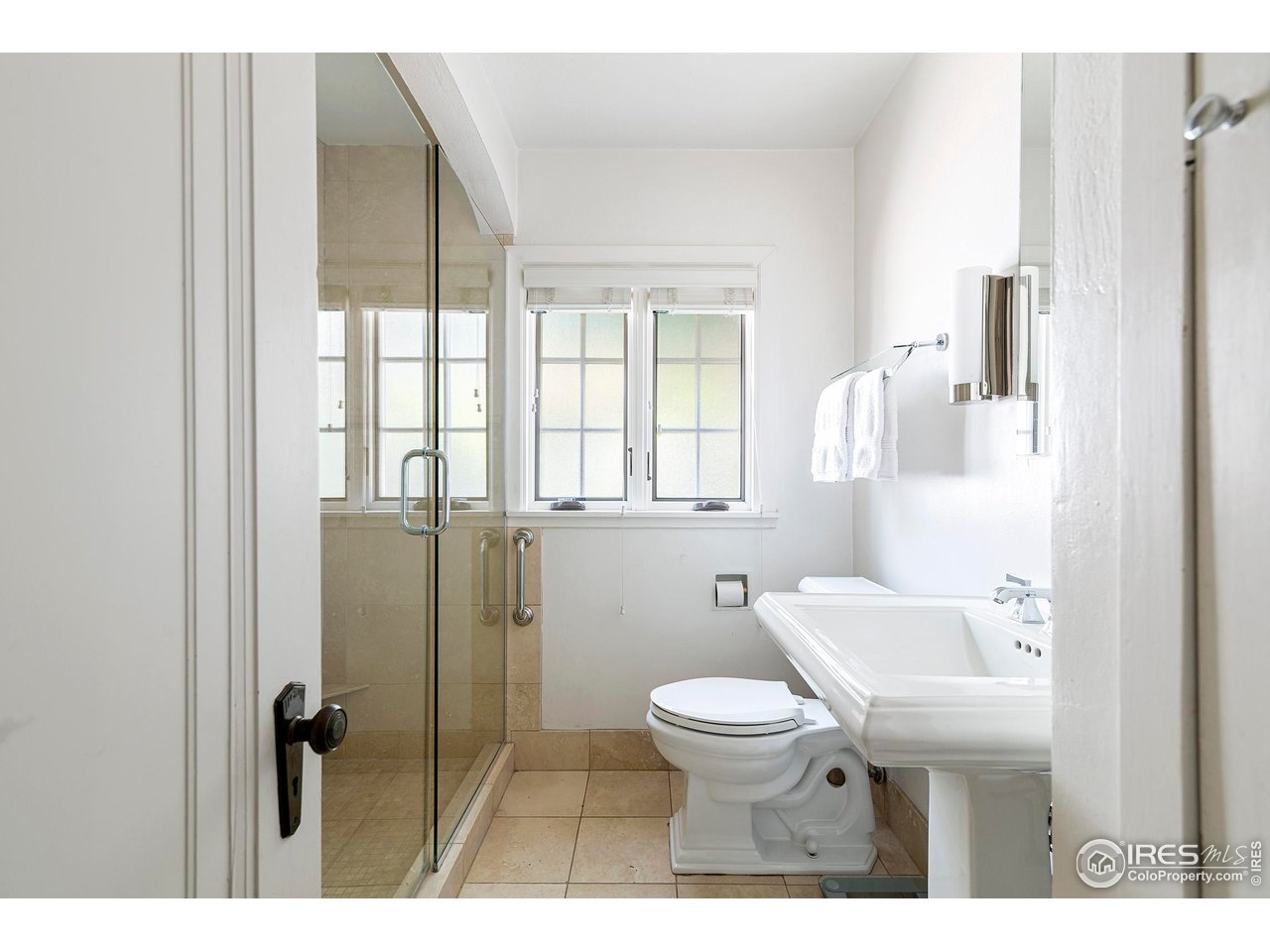 764 14th Street Boulder, CO 80302 - Photo 17 of 40 a bathroom with a toilet sink and a shower