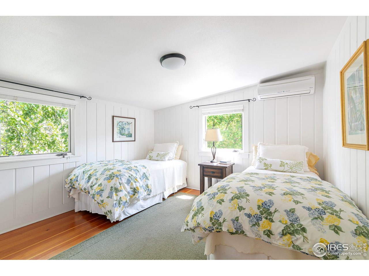 764 14th Street Boulder, CO 80302 - Photo 23 of 40 a bedroom with a bed mirror and window