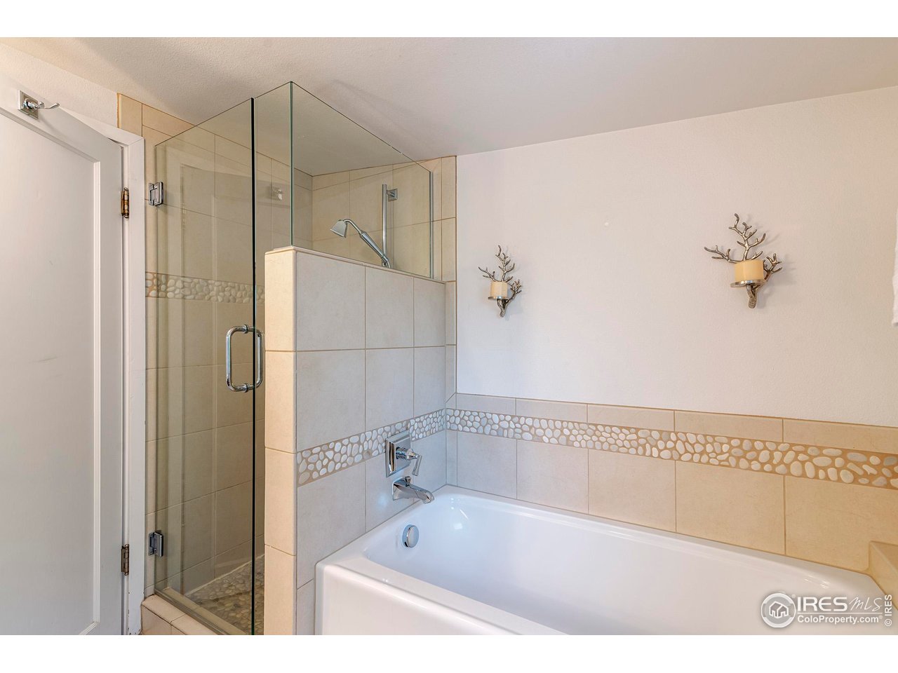 764 14th Street Boulder, CO 80302 - Photo 30 of 40 a bathroom with a bathtub and a shower