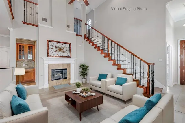 a living room with furniture and a fireplace