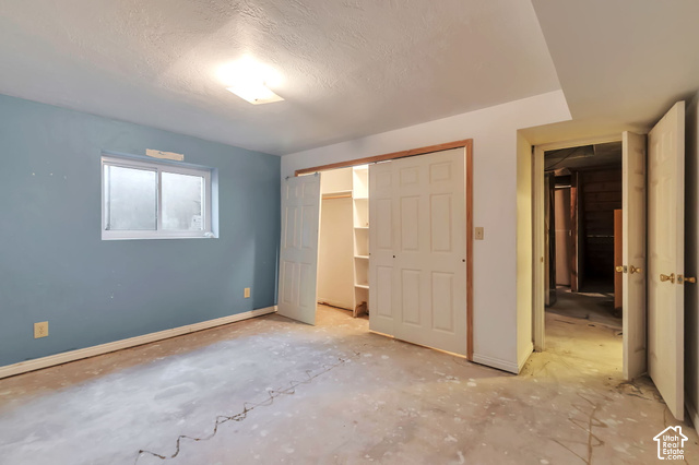 386 North 210 East Mapleton, UT 84664 - Photo 26 of 30 Window with white framing, light blue wall paint, white trim, sliding closet doors, built-in closet shelving