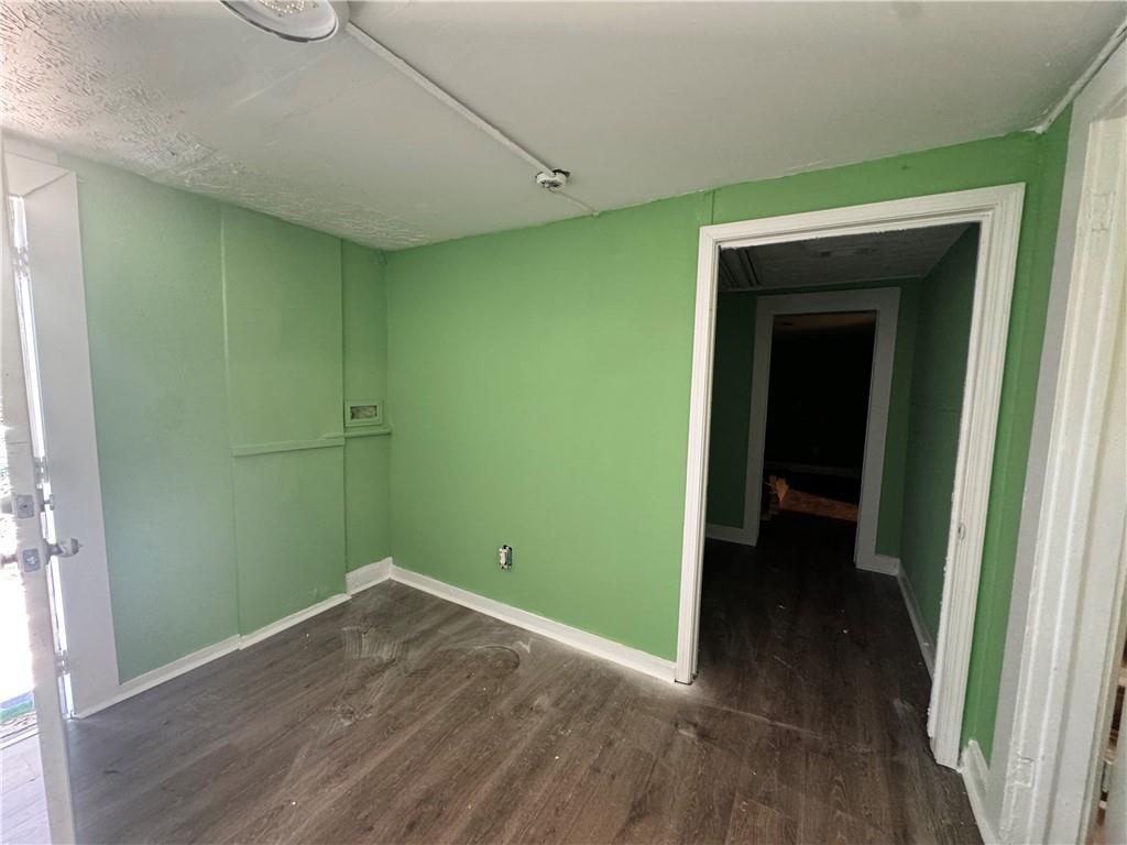 1292 Ralph David Abernathy Boulevard Atlanta, GA 30310 - Photo 14 of 16 a view of a room with wooden floor and a window