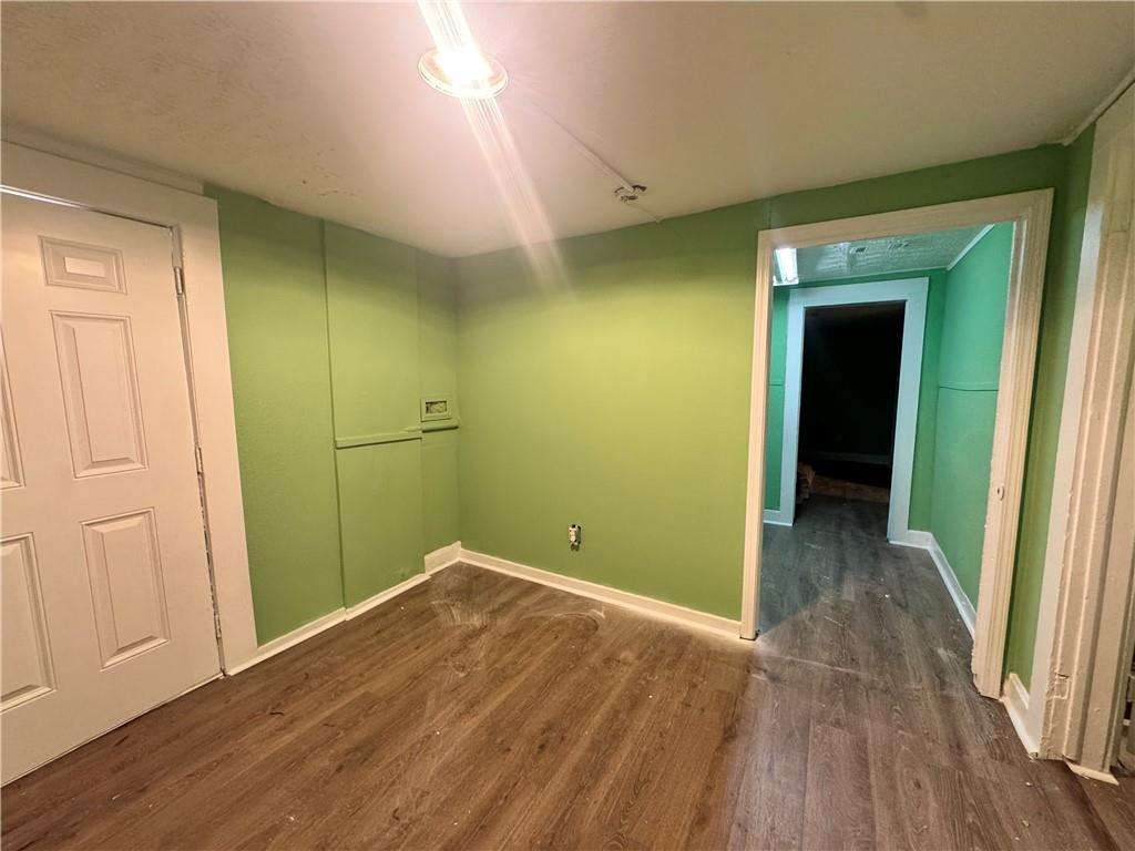 1292 Ralph David Abernathy Boulevard Atlanta, GA 30310 - Photo 15 of 16 a view of a room with wooden floor