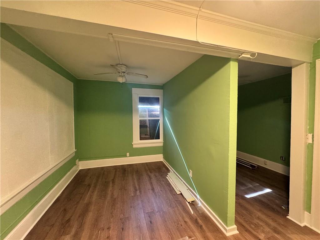 1292 Ralph David Abernathy Boulevard Atlanta, GA 30310 - Photo 7 of 16 a view of a room with wooden floor and a window