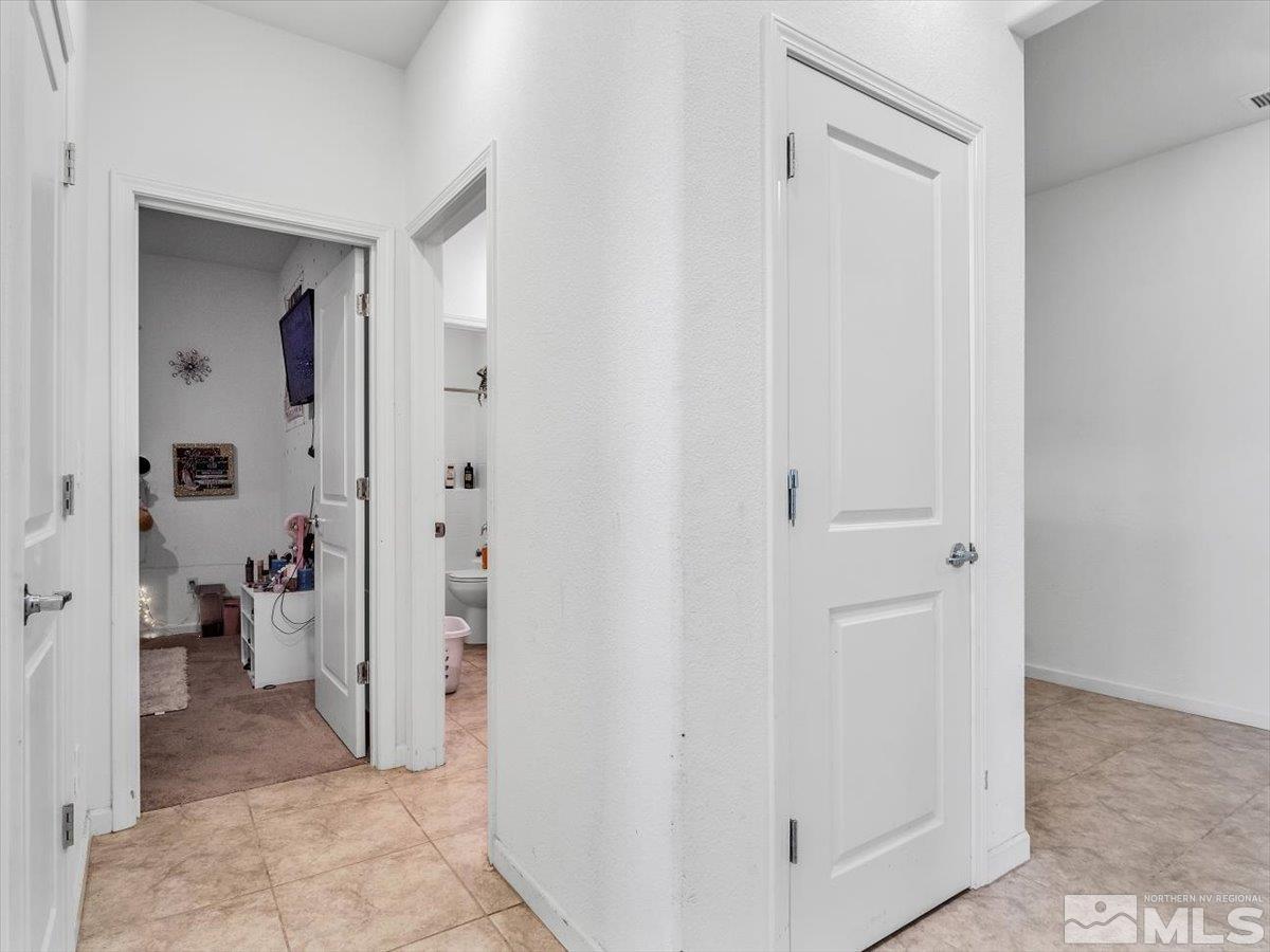 119 Oakmont Drive Dayton, NV 89403 - Photo 15 of 19 a view of a bathroom with a shower and a room