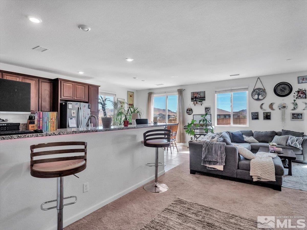 119 Oakmont Drive Dayton, NV 89403 - Photo 3 of 19 a living room with furniture and a wooden floor