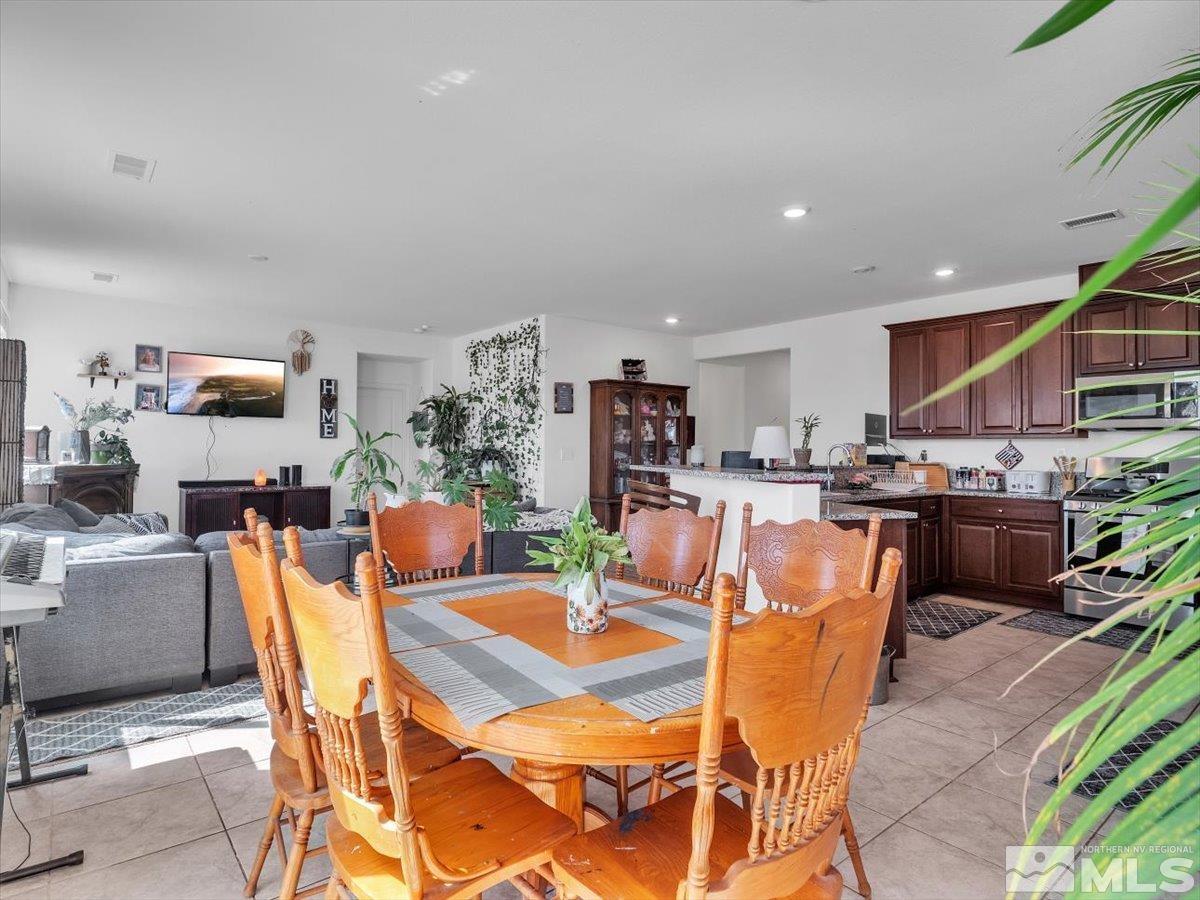 119 Oakmont Drive Dayton, NV 89403 - Photo 6 of 19 a view of a dining room with furniture