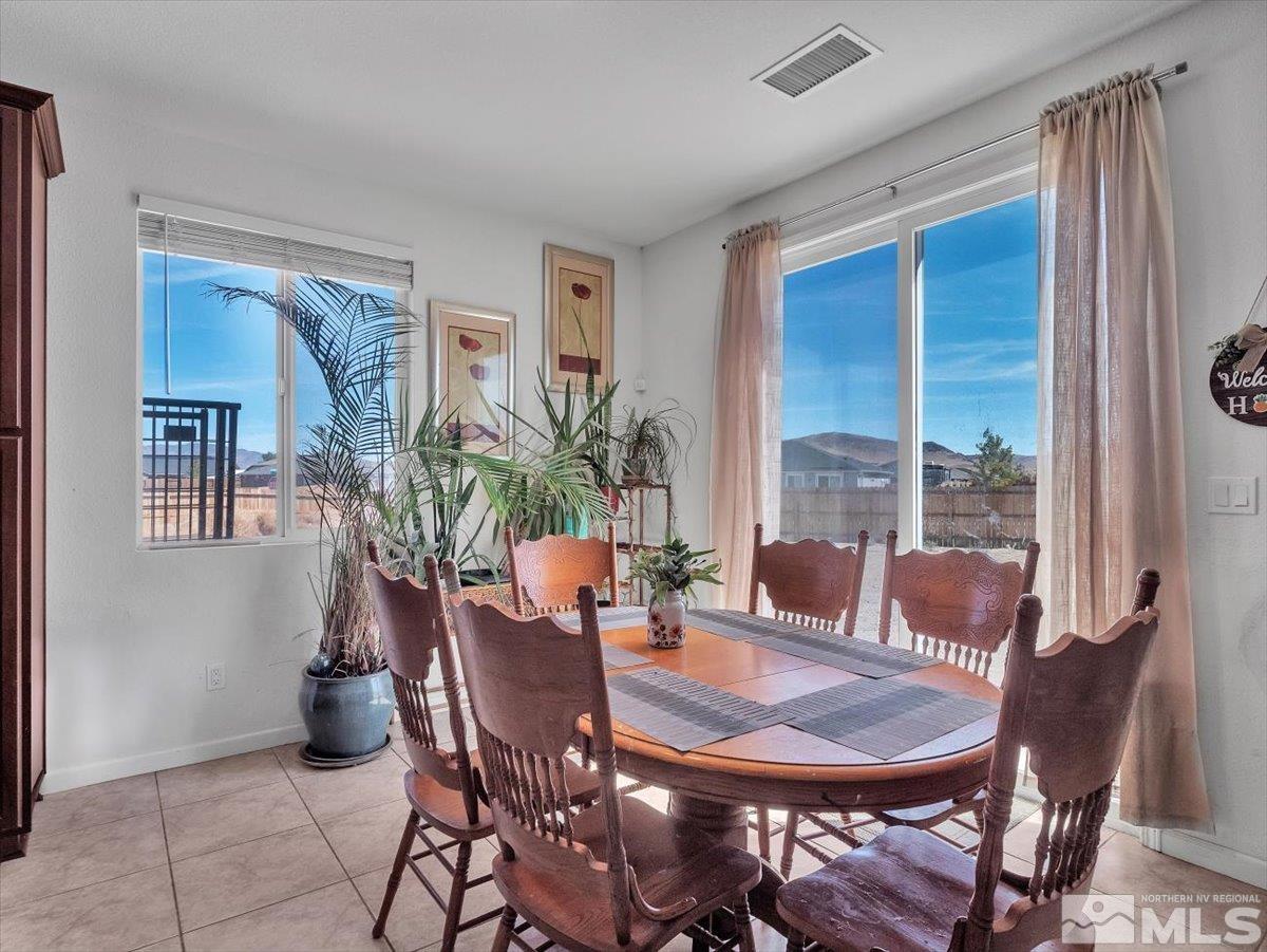 119 Oakmont Drive Dayton, NV 89403 - Photo 7 of 19 a view of a dining room with furniture window and outside view