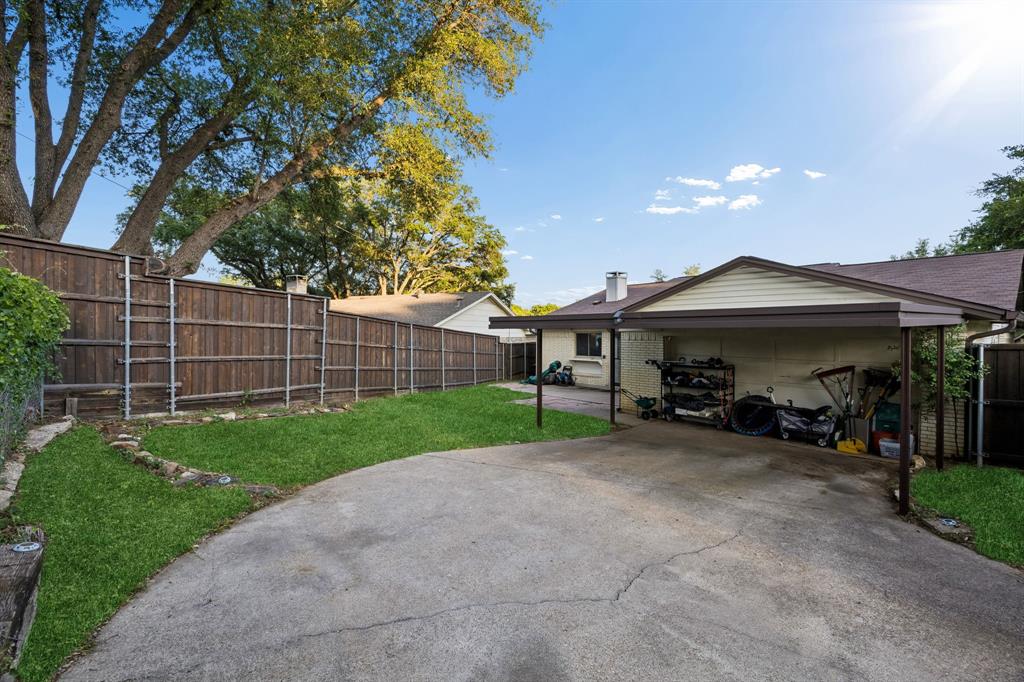 2617 Quail Ridge Irving, TX 75060 - Photo 17 of 17 Back of structure featuring a carport