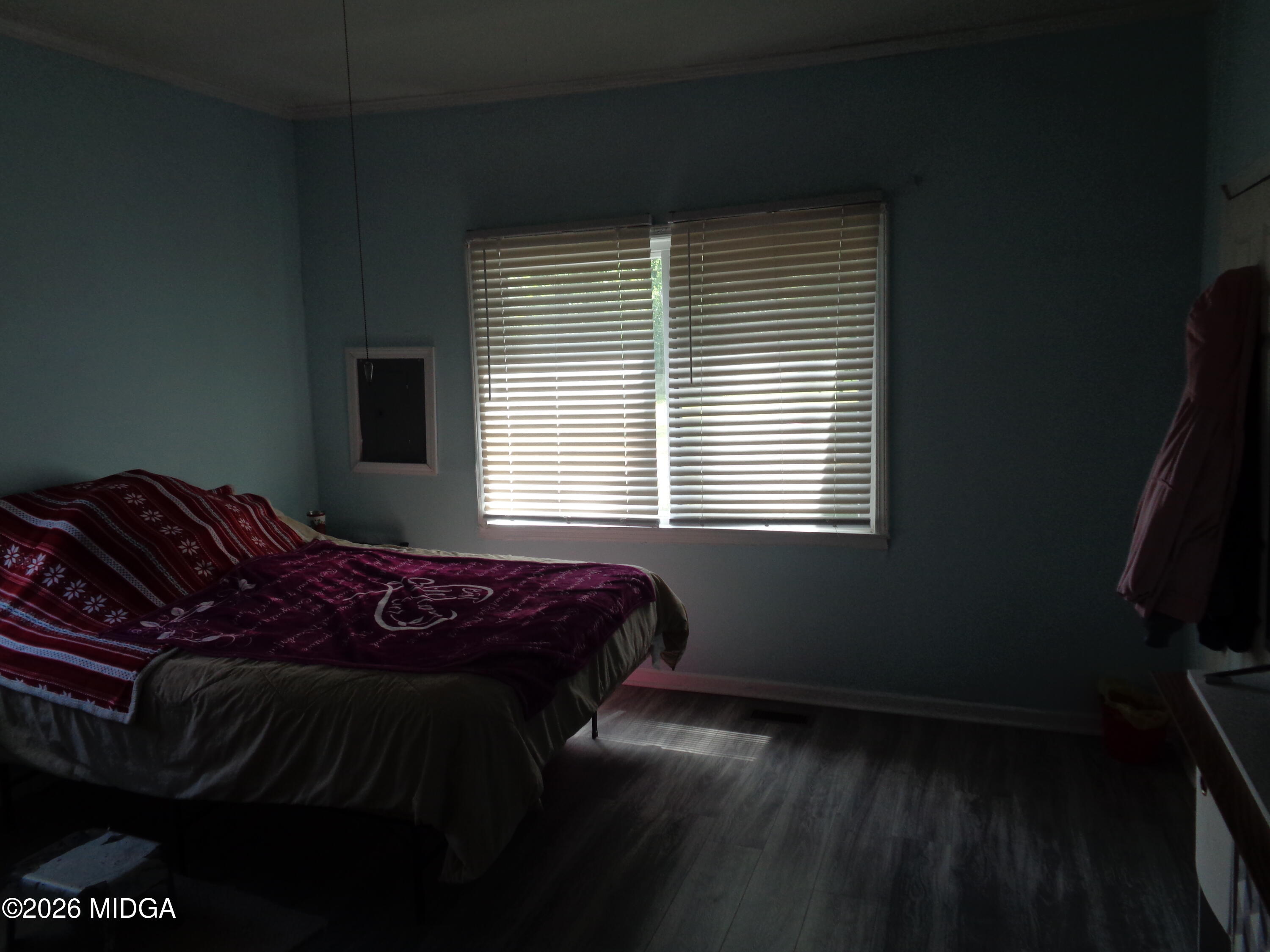 3380 Goodwin Lane Macon, GA 31217 - Photo 16 of 22 a bed sitting in a bedroom next to a window