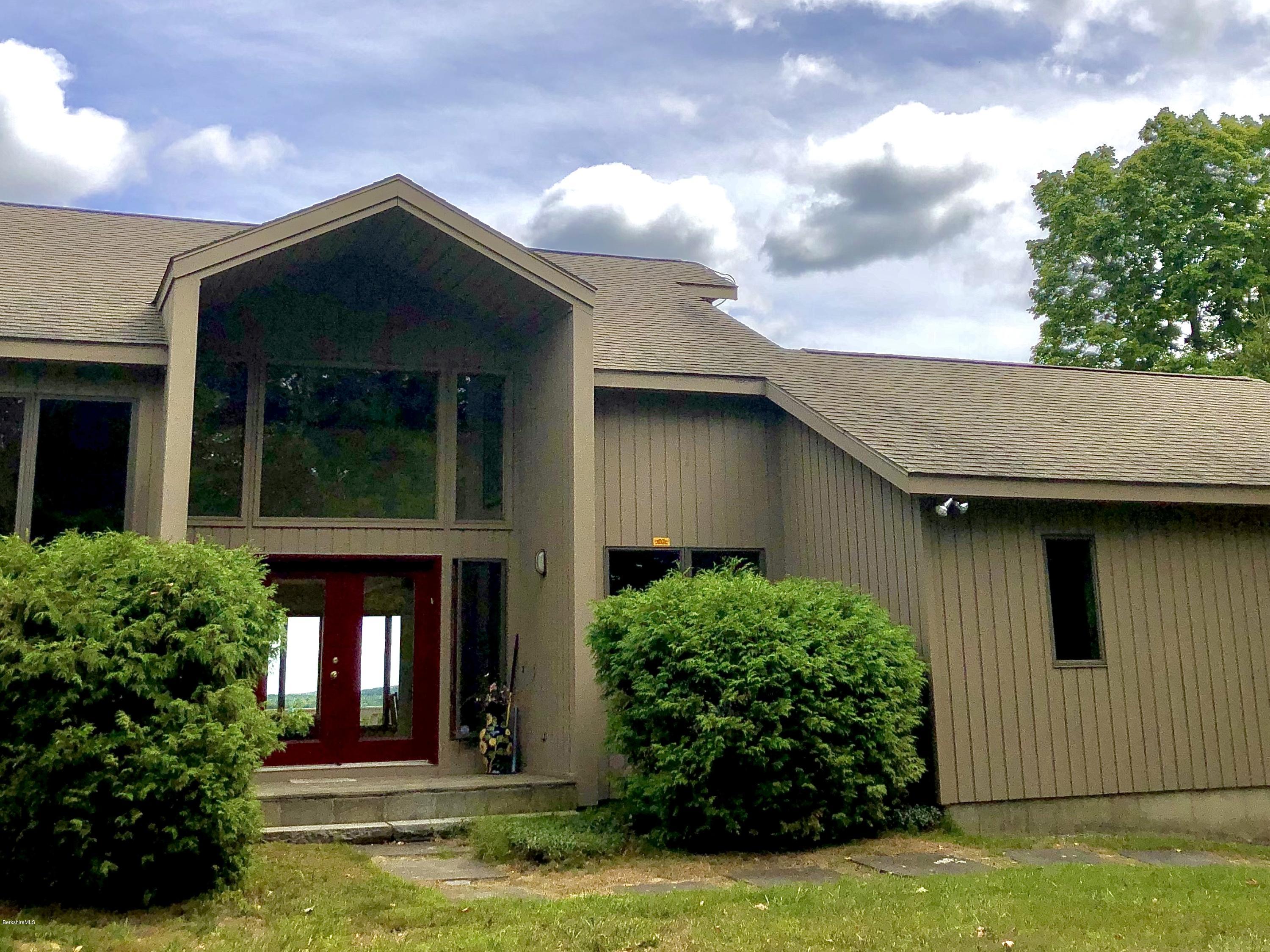 359 Harrington Road Otis, MA 01253 - Photo 11 of 60 a front view of a house with garden