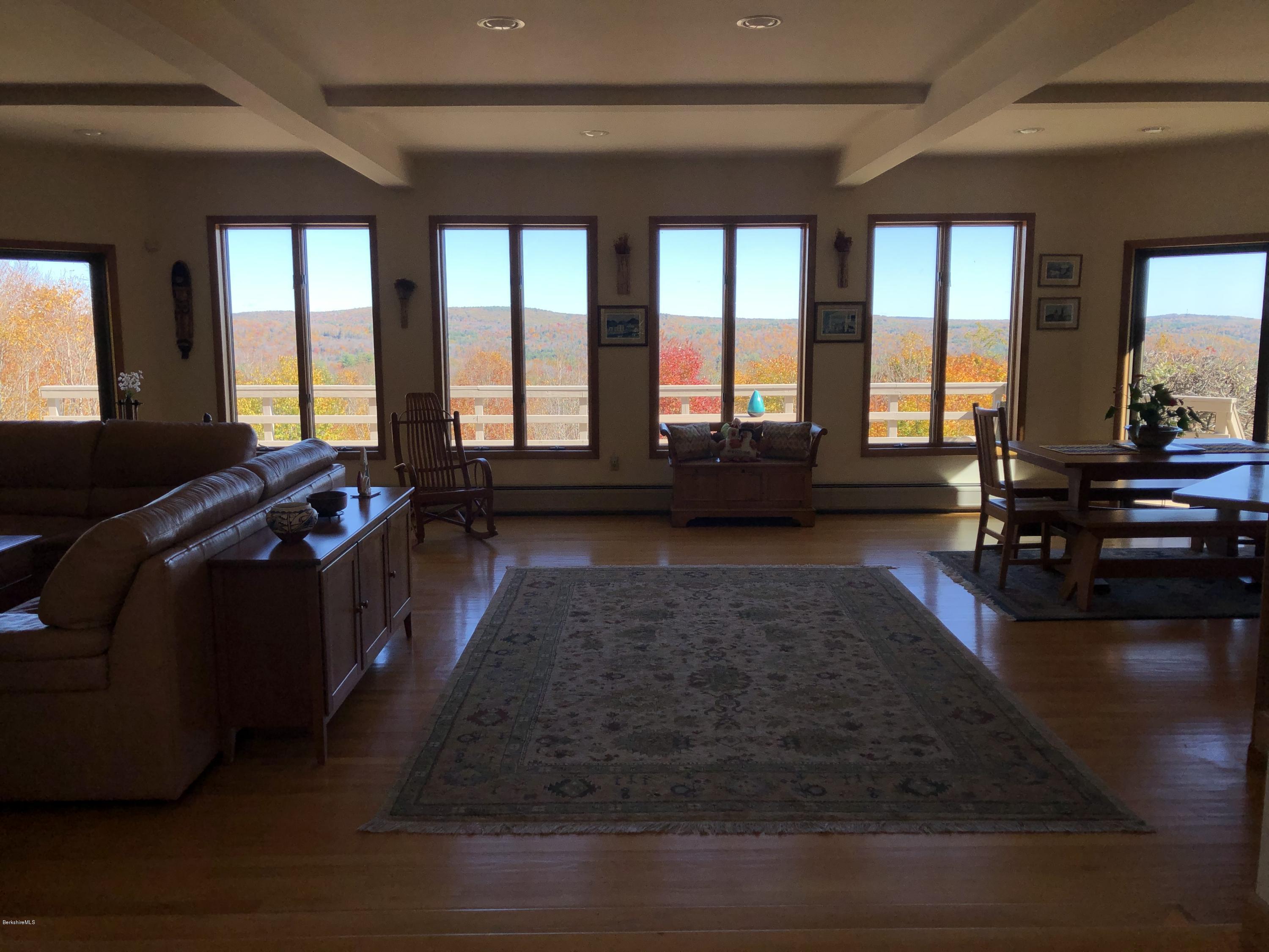359 Harrington Road Otis, MA 01253 - Photo 15 of 60 a living room with furniture and large windows