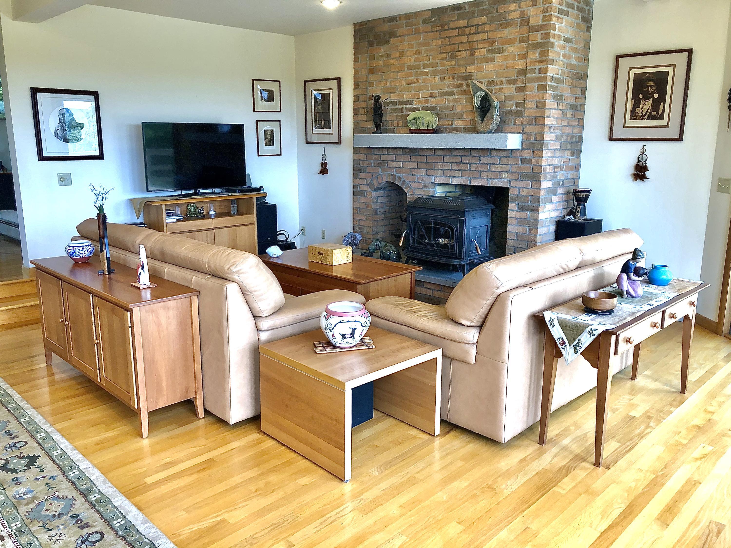 359 Harrington Road Otis, MA 01253 - Photo 17 of 60 a living room with furniture and a flat screen tv