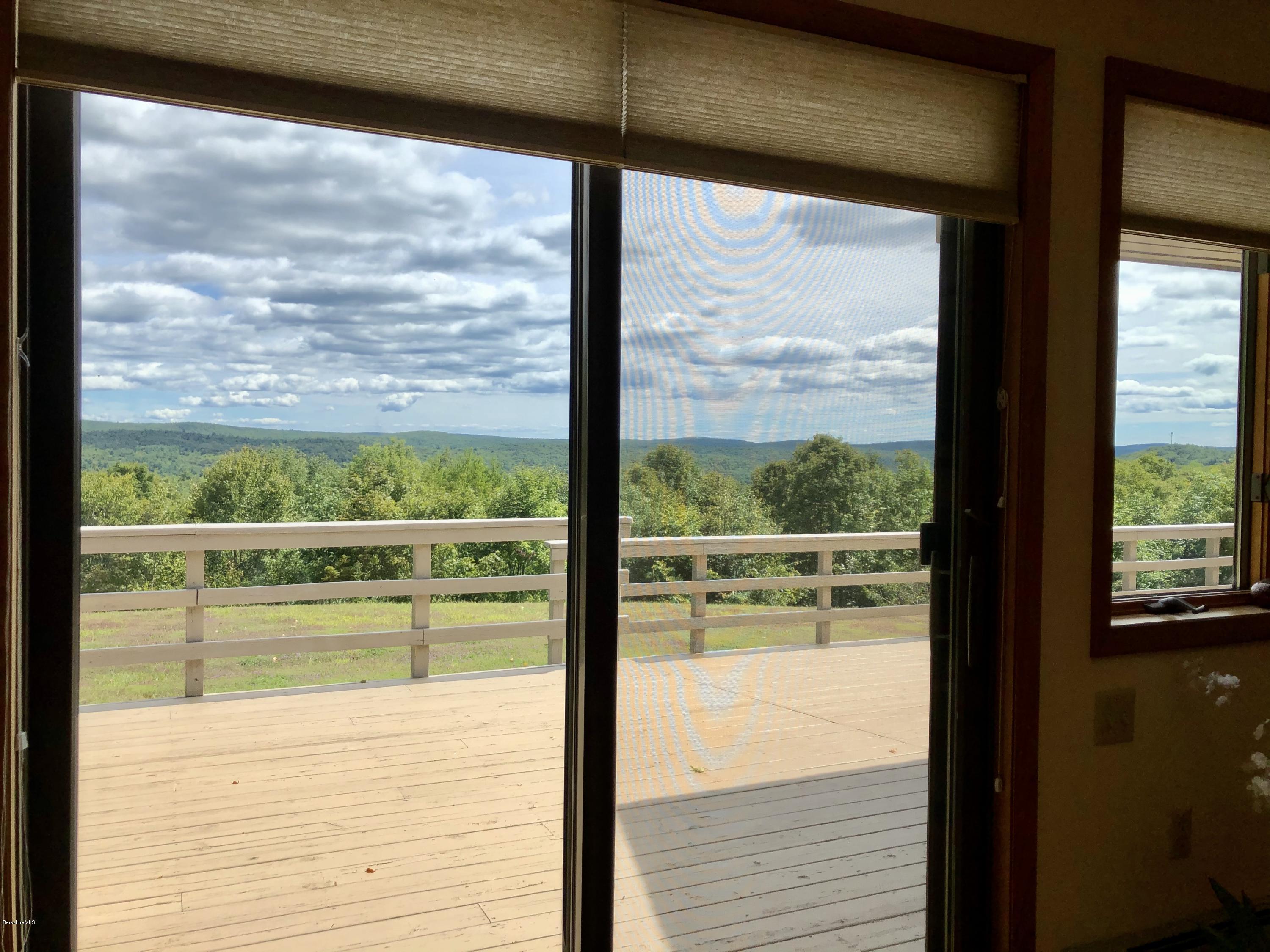 359 Harrington Road Otis, MA 01253 - Photo 26 of 60 a view of a glass door with a large window