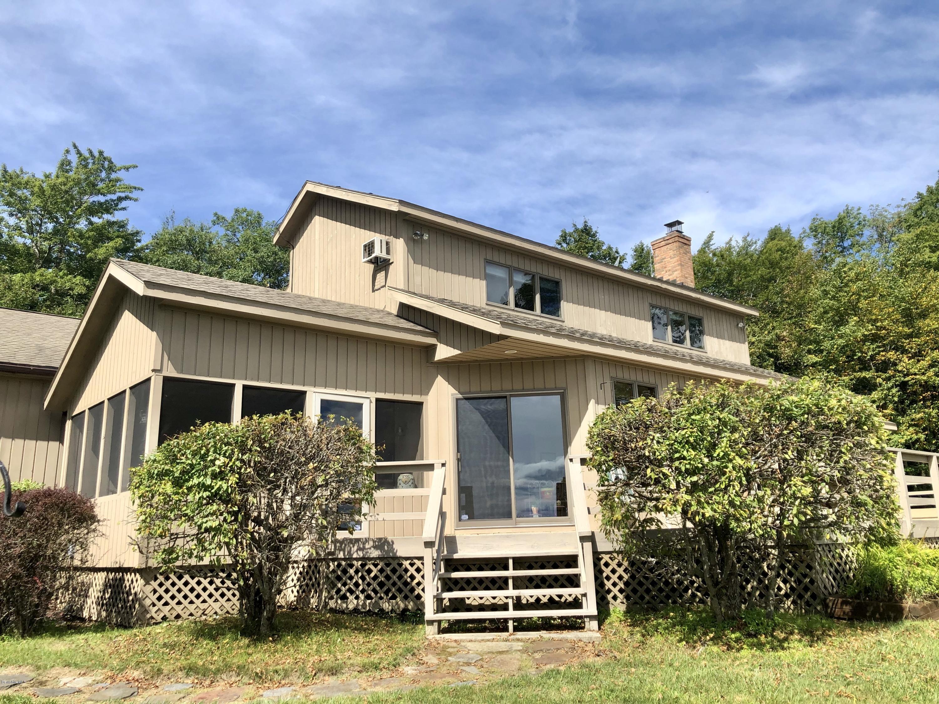 359 Harrington Road Otis, MA 01253 - Photo 4 of 60 a view of a house with a yard