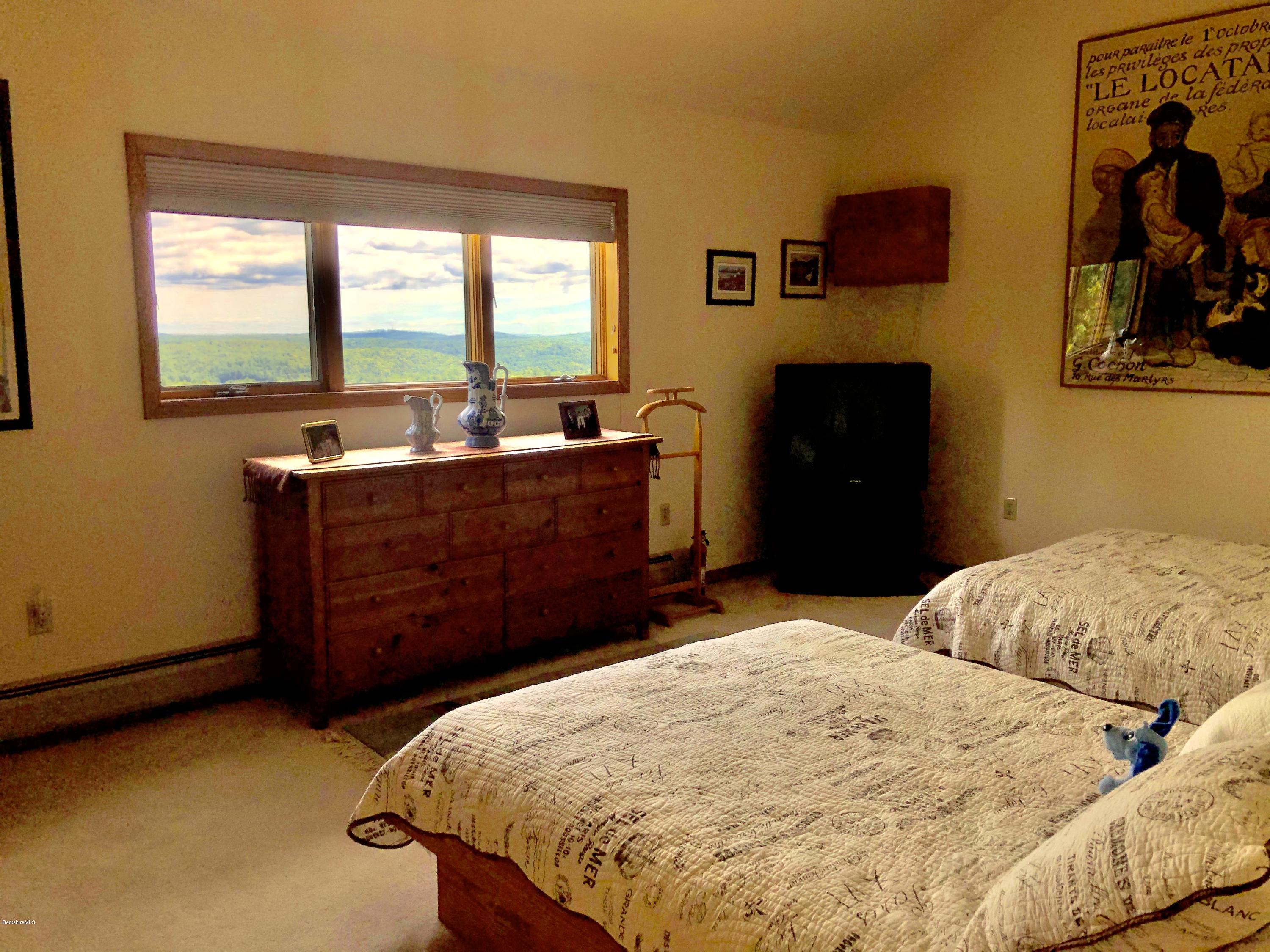 359 Harrington Road Otis, MA 01253 - Photo 34 of 60 a bed room with a bed and a television