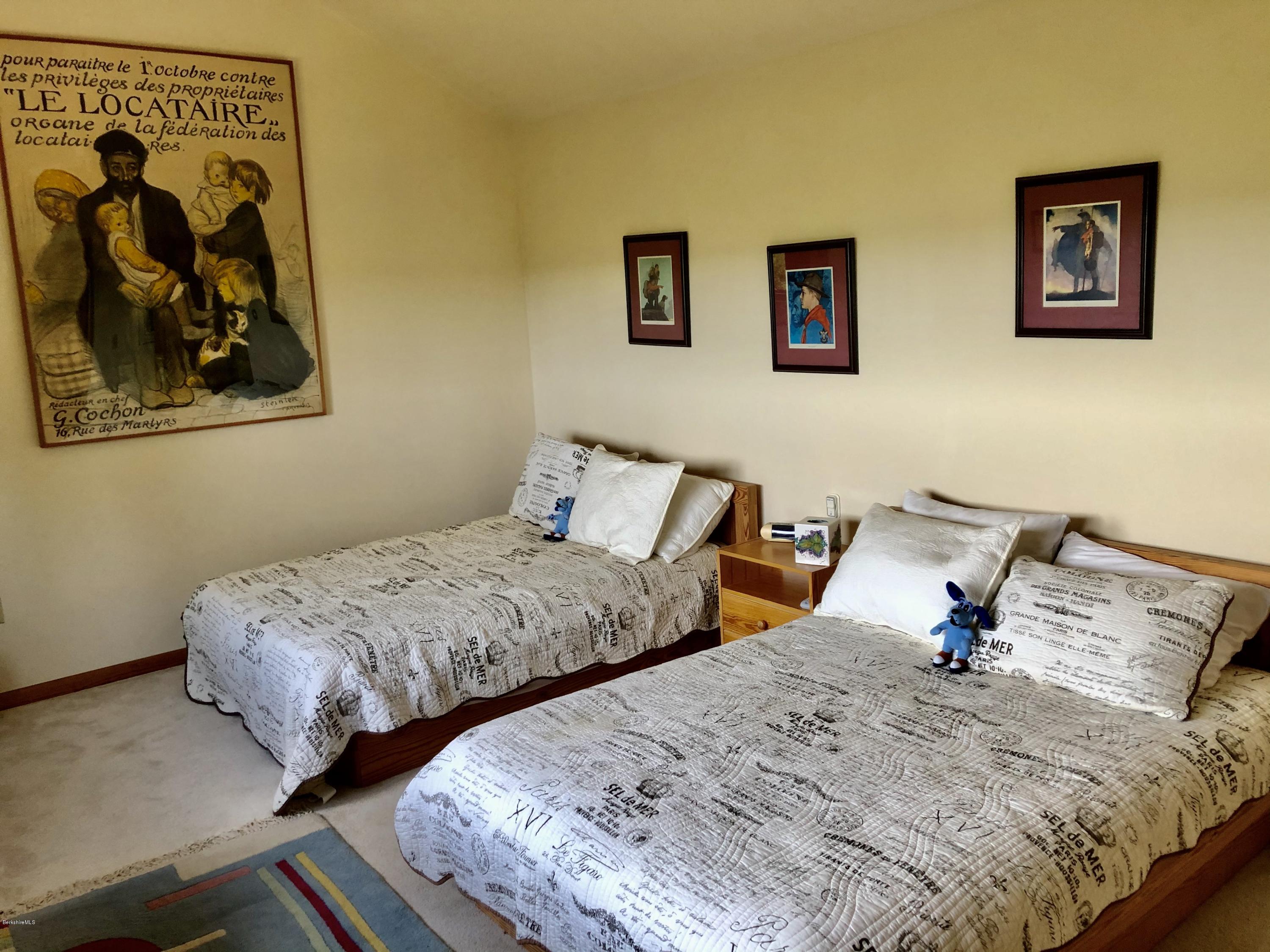 359 Harrington Road Otis, MA 01253 - Photo 35 of 60 a bedroom with two bed and a painting on the wall