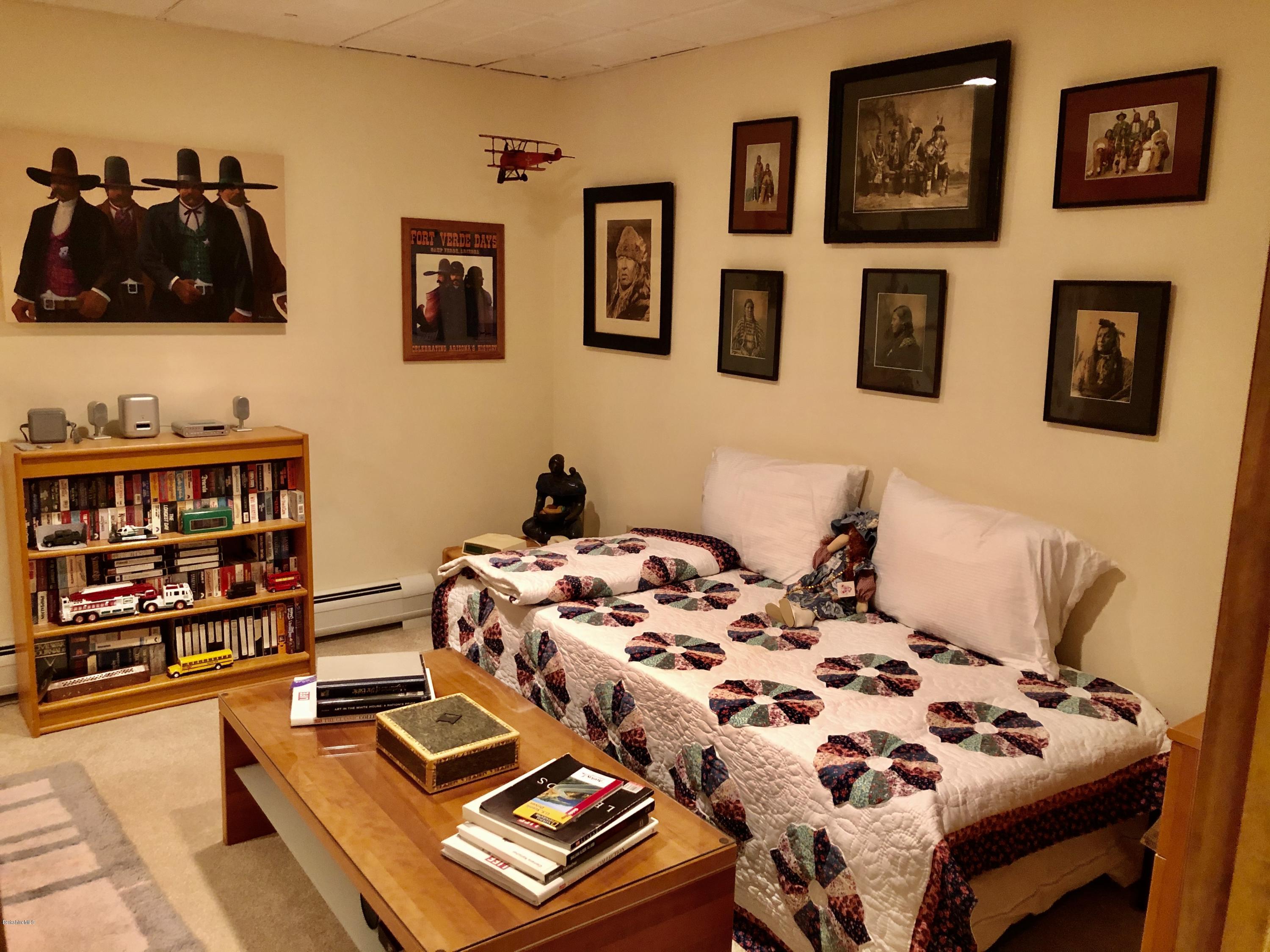 359 Harrington Road Otis, MA 01253 - Photo 38 of 60 a bedroom with furniture and book shelf