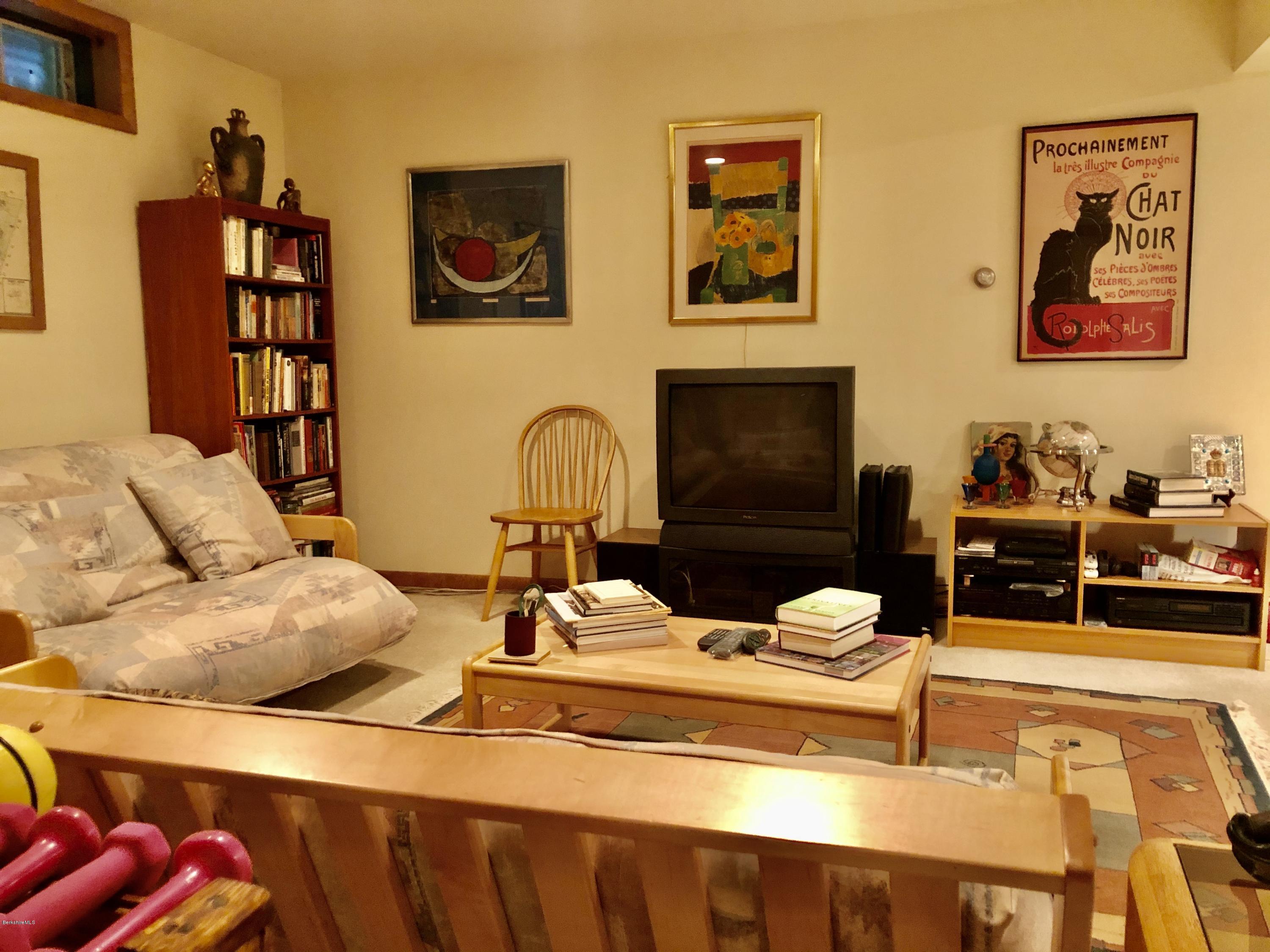 359 Harrington Road Otis, MA 01253 - Photo 44 of 60 a living room with furniture and a flat screen tv