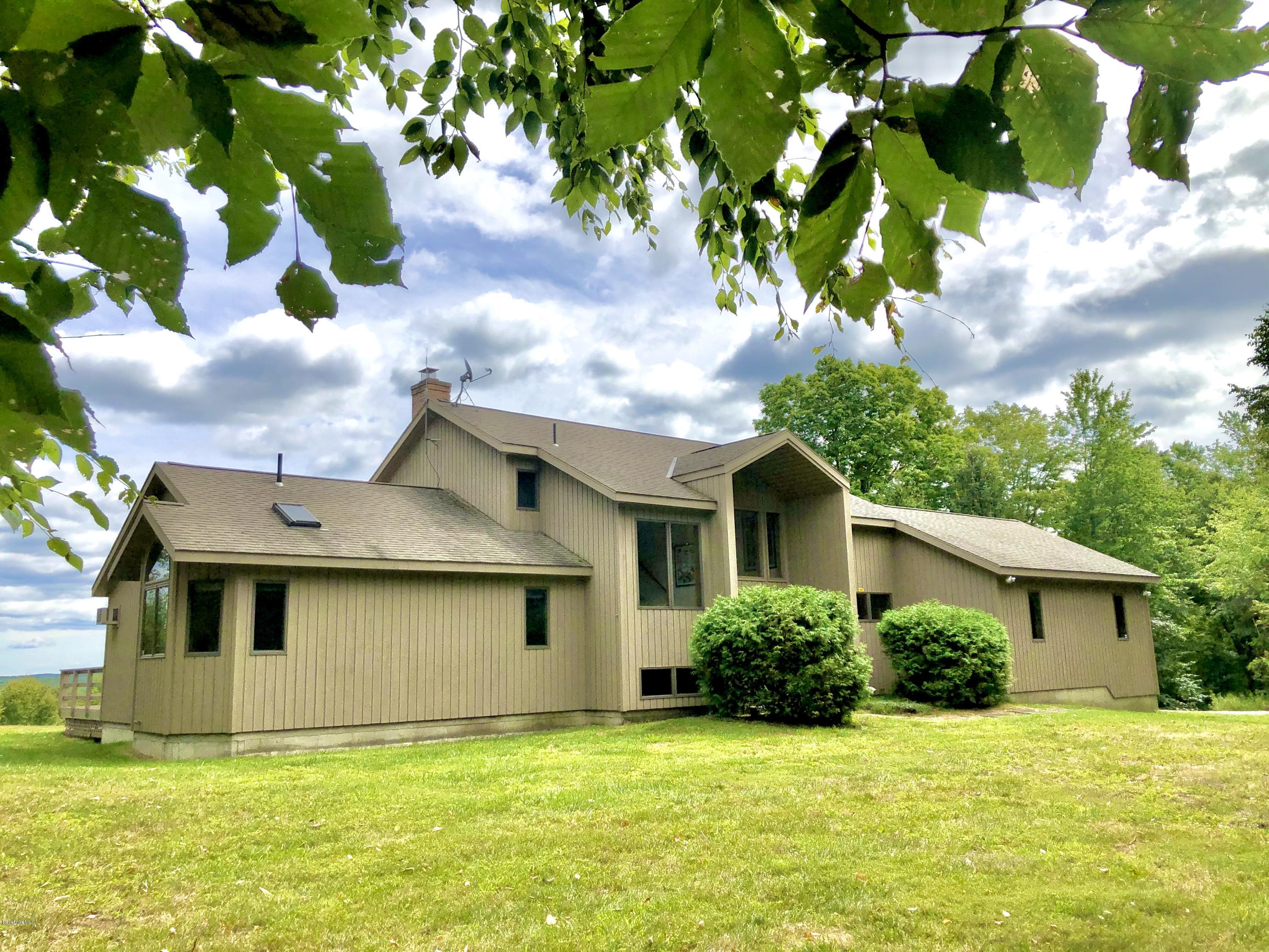 359 Harrington Road Otis, MA 01253 - Photo 10 of 60 a view of a house with a yard
