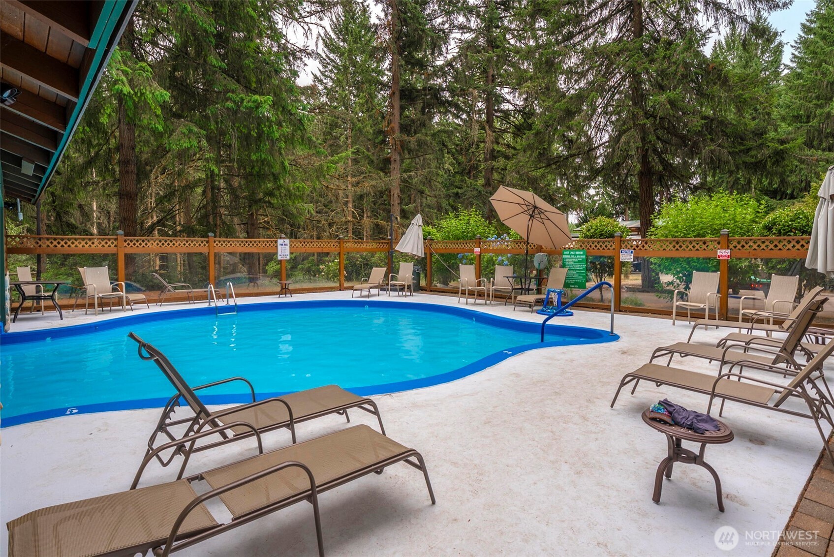 1546 Reservation Road Southeast, Unit 218 Olympia, WA 98513 - Photo 36 of 40 a view of a swimming pool with chairs