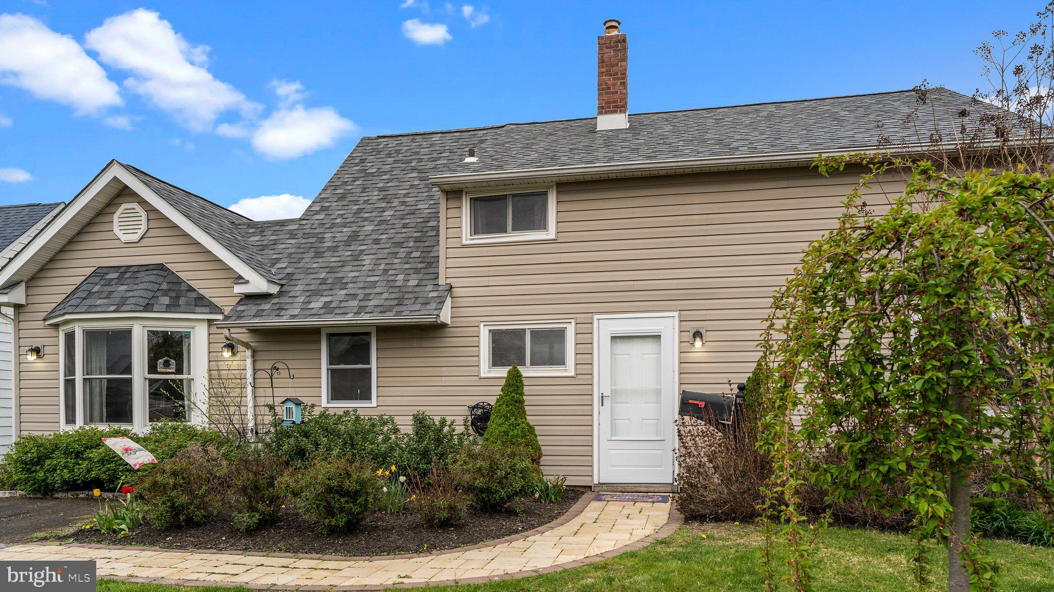 55 Grapevine Road Levittown, PA 19057 - Photo 2 of 27 a front view of a house with garden