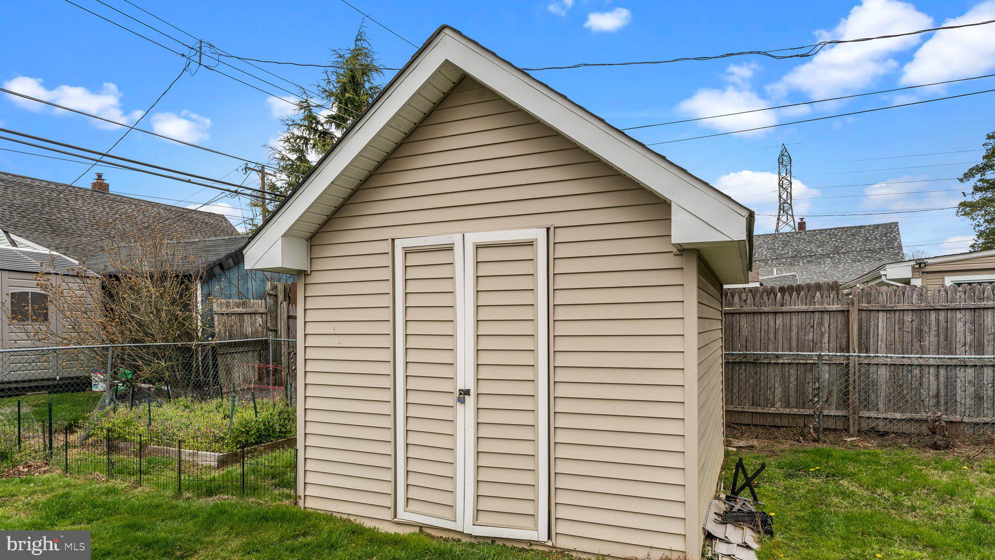 55 Grapevine Road Levittown, PA 19057 - Photo 27 of 27 a view of a house with a yard and potted plants