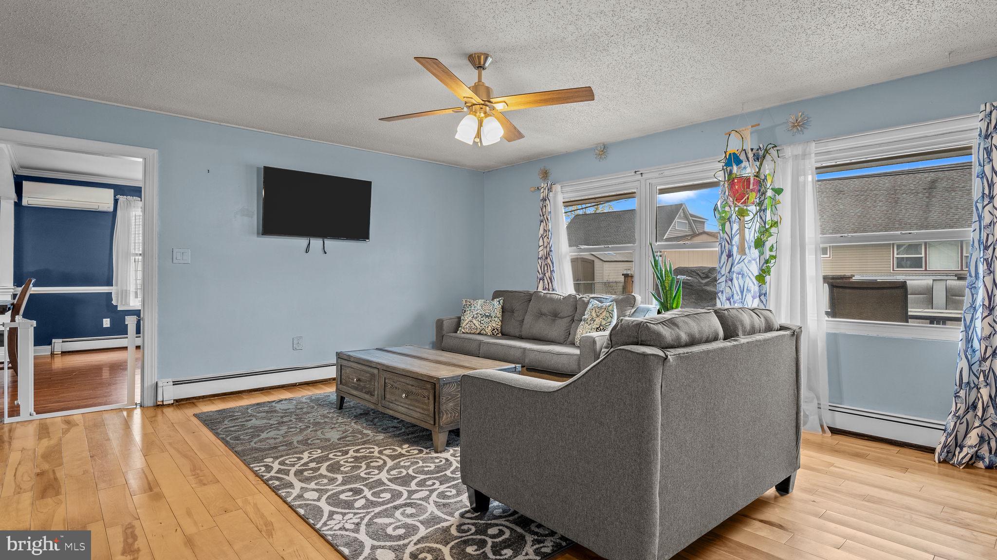 55 Grapevine Road Levittown, PA 19057 - Photo 6 of 27 a living room with furniture and a flat screen tv