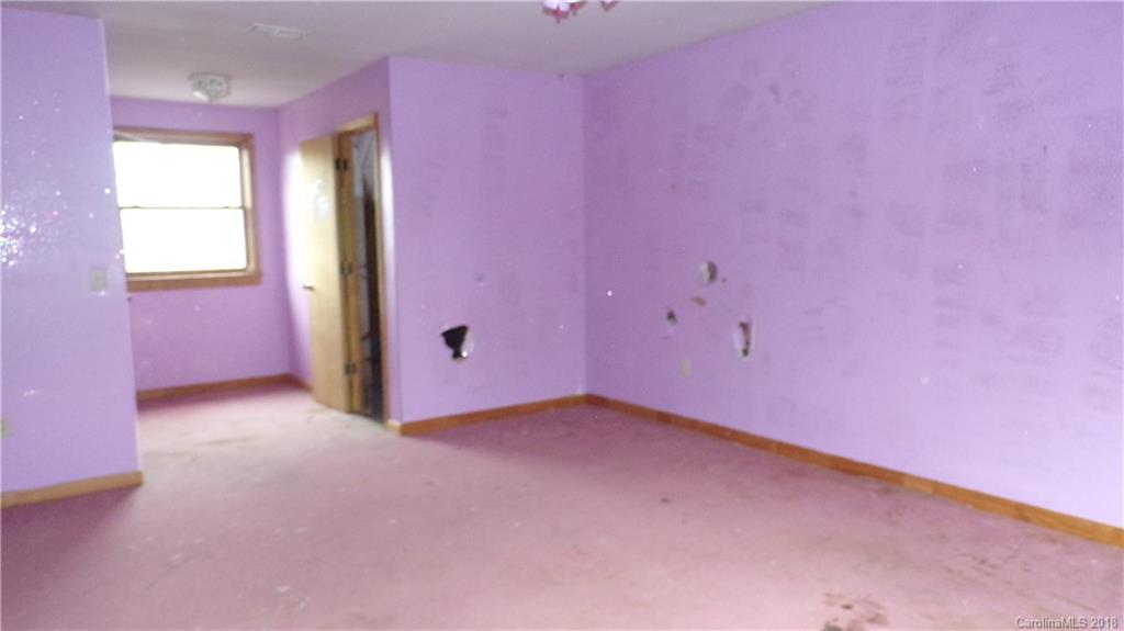 185 Mountain Mission Road Clyde, NC 28721 - Photo 12 of 23 an empty room with windows
