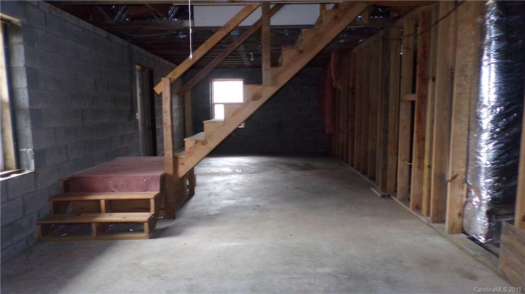185 Mountain Mission Road Clyde, NC 28721 - Photo 15 of 23 a view of a hallway with staircase