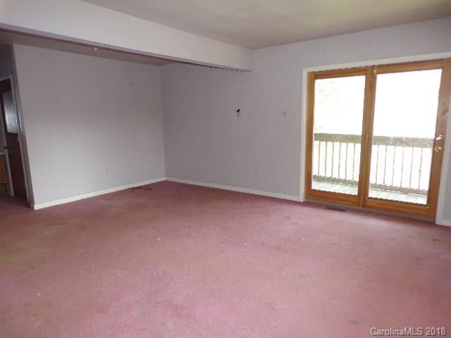 185 Mountain Mission Road Clyde, NC 28721 - Photo 22 of 23 a view of an empty room with a window