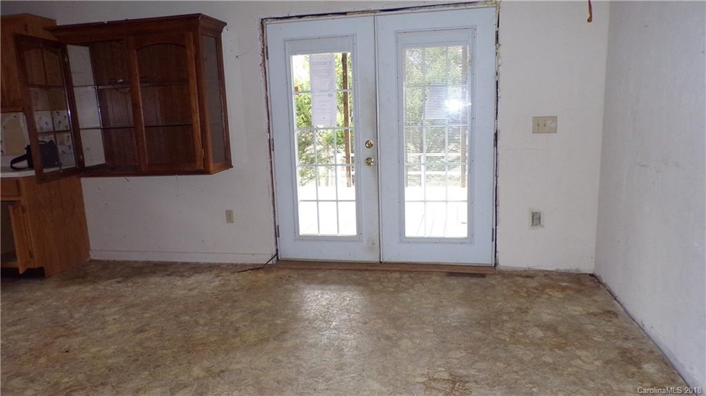 185 Mountain Mission Road Clyde, NC 28721 - Photo 7 of 23 a view of an empty room with a window