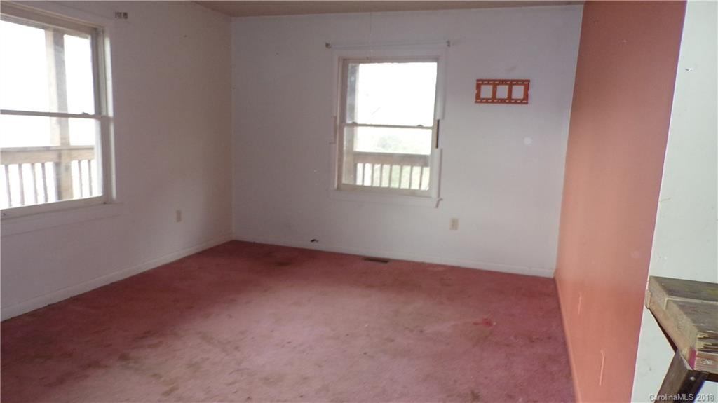 185 Mountain Mission Road Clyde, NC 28721 - Photo 10 of 23 an empty room with windows