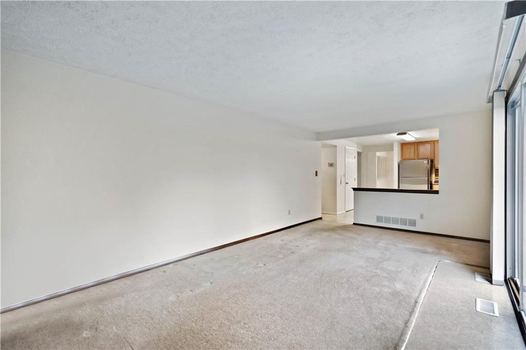106 Pheasant Run Drive Export, PA 15632 - Photo 11 of 25 an empty room with windows