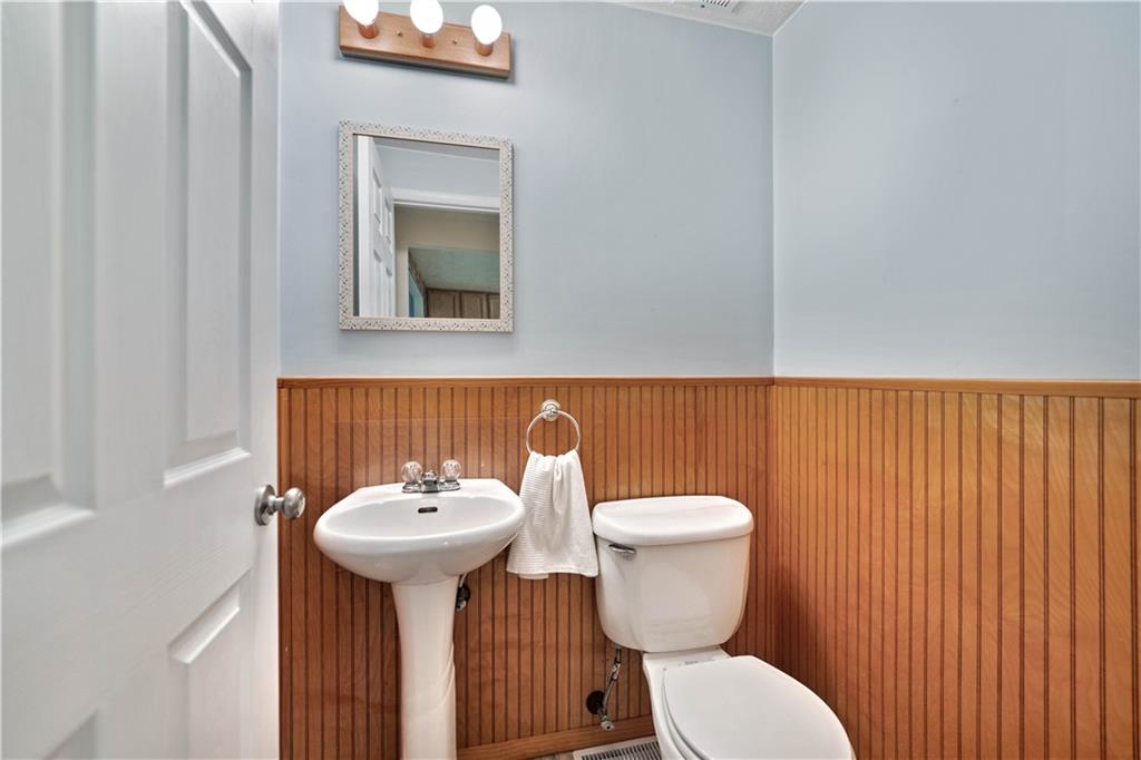 106 Pheasant Run Drive Export, PA 15632 - Photo 12 of 25 a bathroom with a toilet a sink and mirror