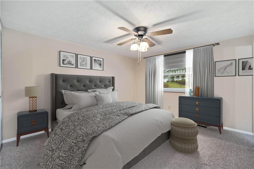 106 Pheasant Run Drive Export, PA 15632 - Photo 13 of 25 a bedroom with a bed and a chandelier