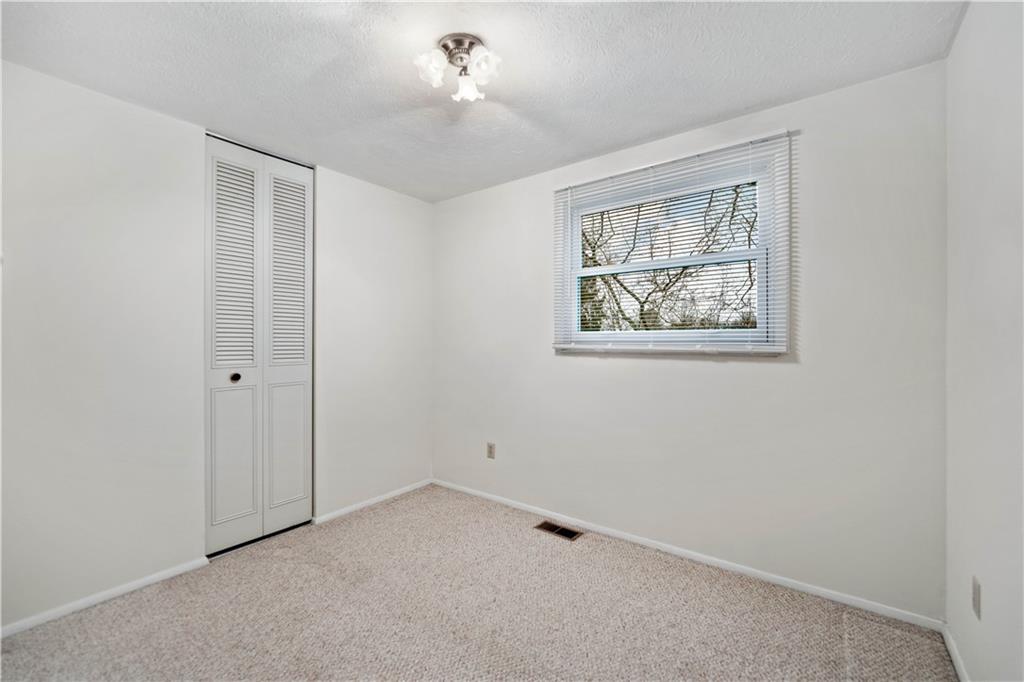 106 Pheasant Run Drive Export, PA 15632 - Photo 15 of 25 a view of an empty room with a window
