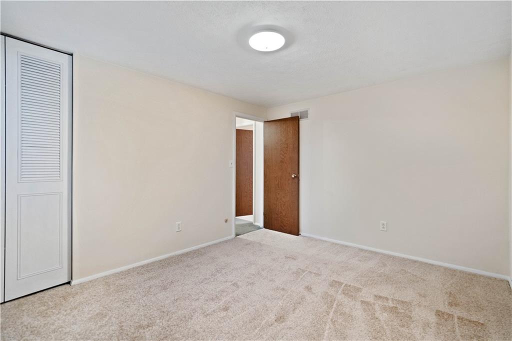 106 Pheasant Run Drive Export, PA 15632 - Photo 17 of 25 a view of an empty room with a window
