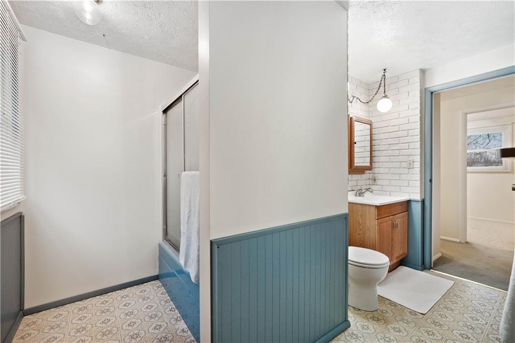 106 Pheasant Run Drive Export, PA 15632 - Photo 19 of 25 a bathroom with a sink a toilet and shower