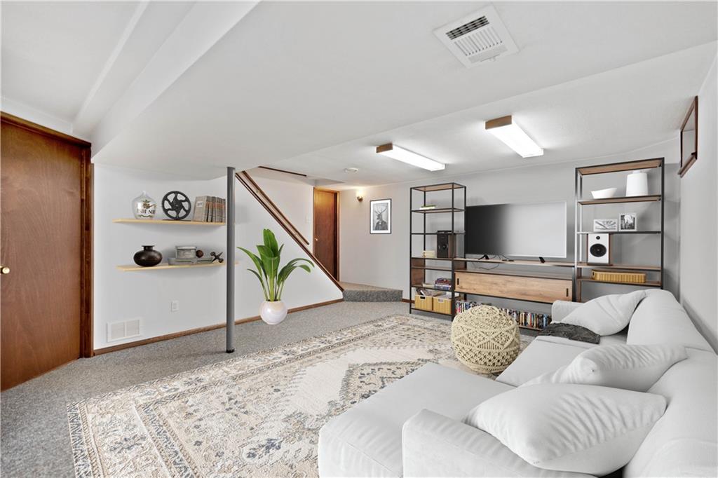 106 Pheasant Run Drive Export, PA 15632 - Photo 20 of 25 a living room with furniture and a flat screen tv