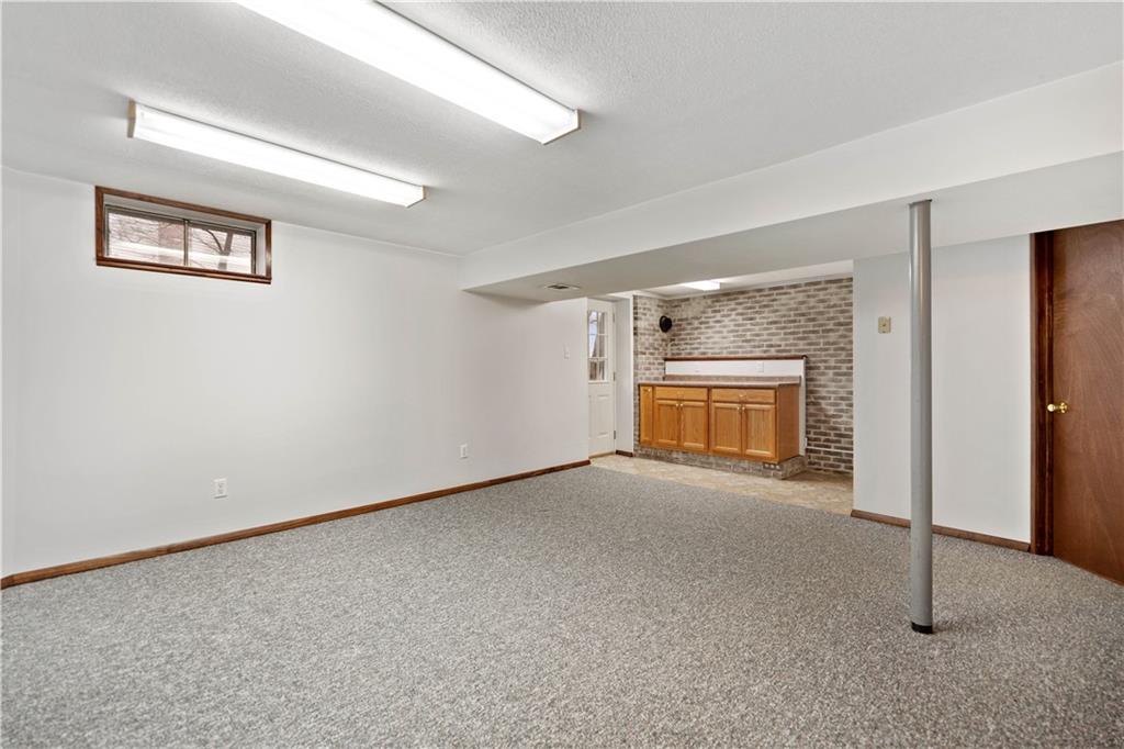 106 Pheasant Run Drive Export, PA 15632 - Photo 21 of 25 a view of empty room with a fireplace