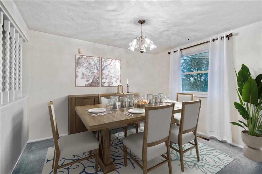 106 Pheasant Run Drive Export, PA 15632 - Photo 6 of 25 a view of a dining room with furniture window and wooden floor
