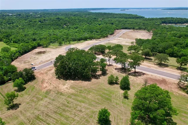 a view of a road with a trees in the background