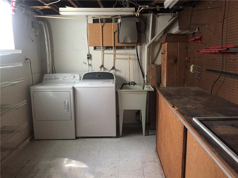 224 Orchard Spring Road Pittsburgh, PA 15220 - Photo 14 of 16 Nice laundry room with storage and work area